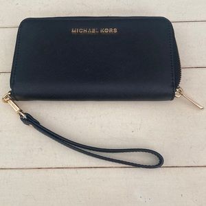 Michael Kors Saffiano leather zip wallet. # 157